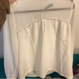 white blouse with pearls